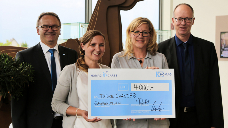 The donation is presented at HOMAG in Schopfloch to Future Chances