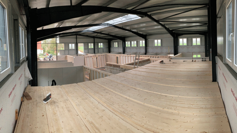 Precise panels were required for the integration of a two-storey timber construction in an existing hall.