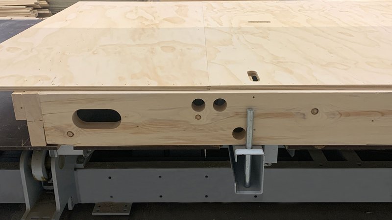 Assembly tables with adjustable hinged sites